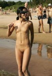 beautiful naked woman walking on non nude beach